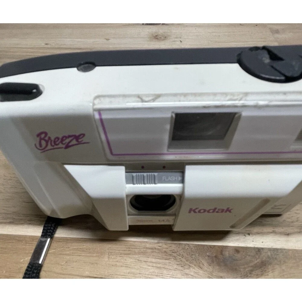 Kodak White Breeze Point-and-Shoot Camera with Black Strap and Pink Accents